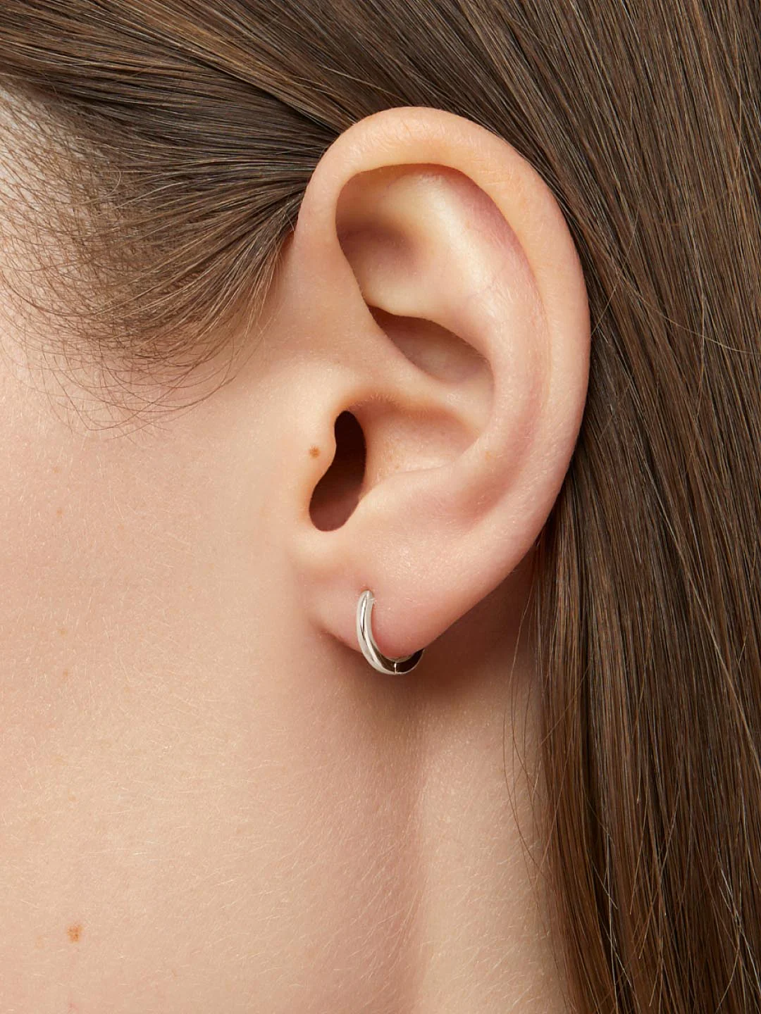 White Huggie Gold Hoop Earrings - Image 2